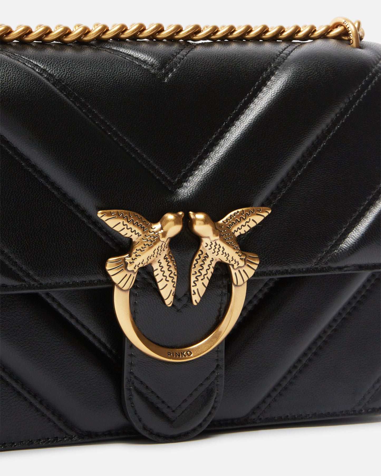 Medium Love Bag pebbled leather crossbody bag with V-shaped pattern and logo