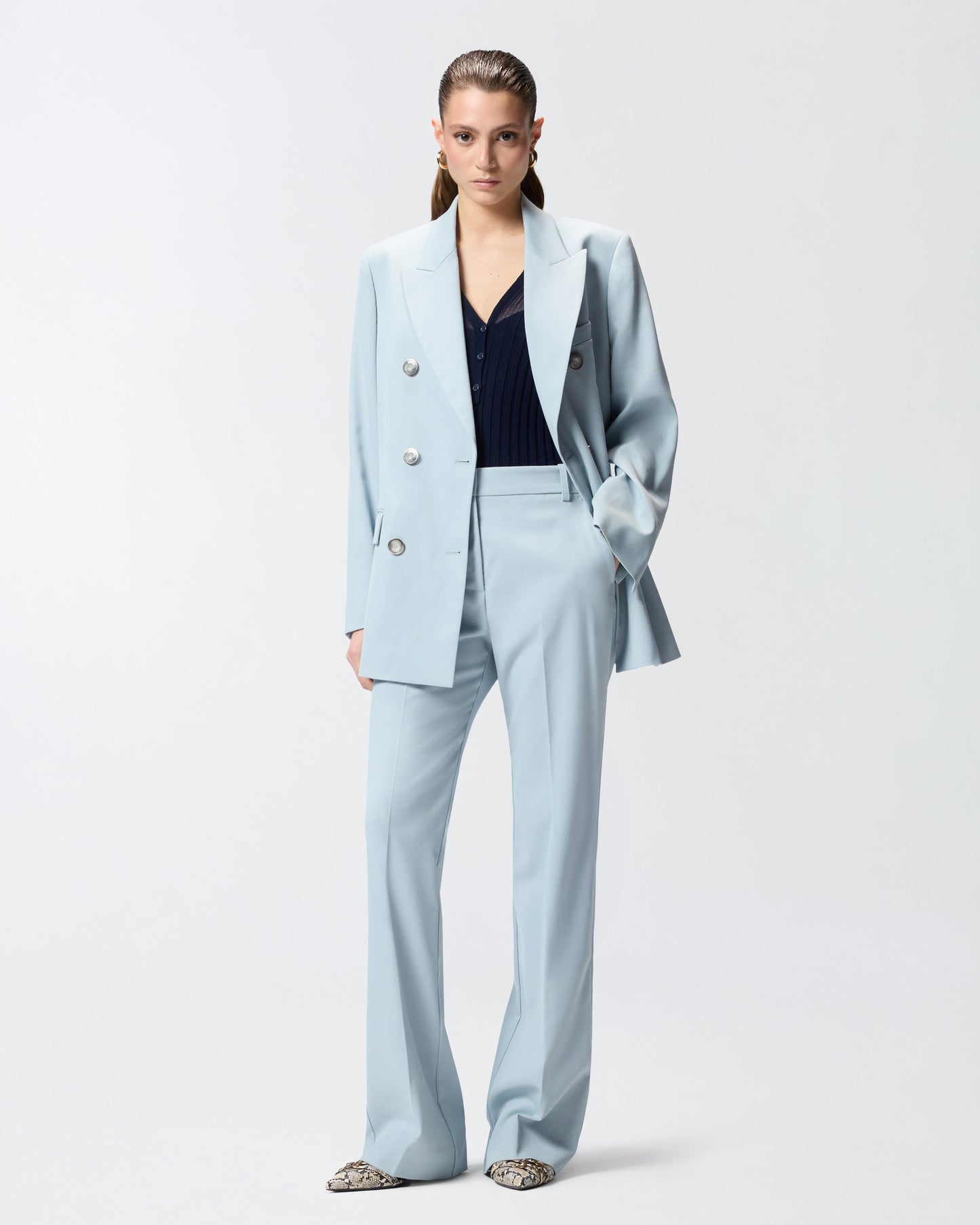 Flared trousers with pressed pleat detail