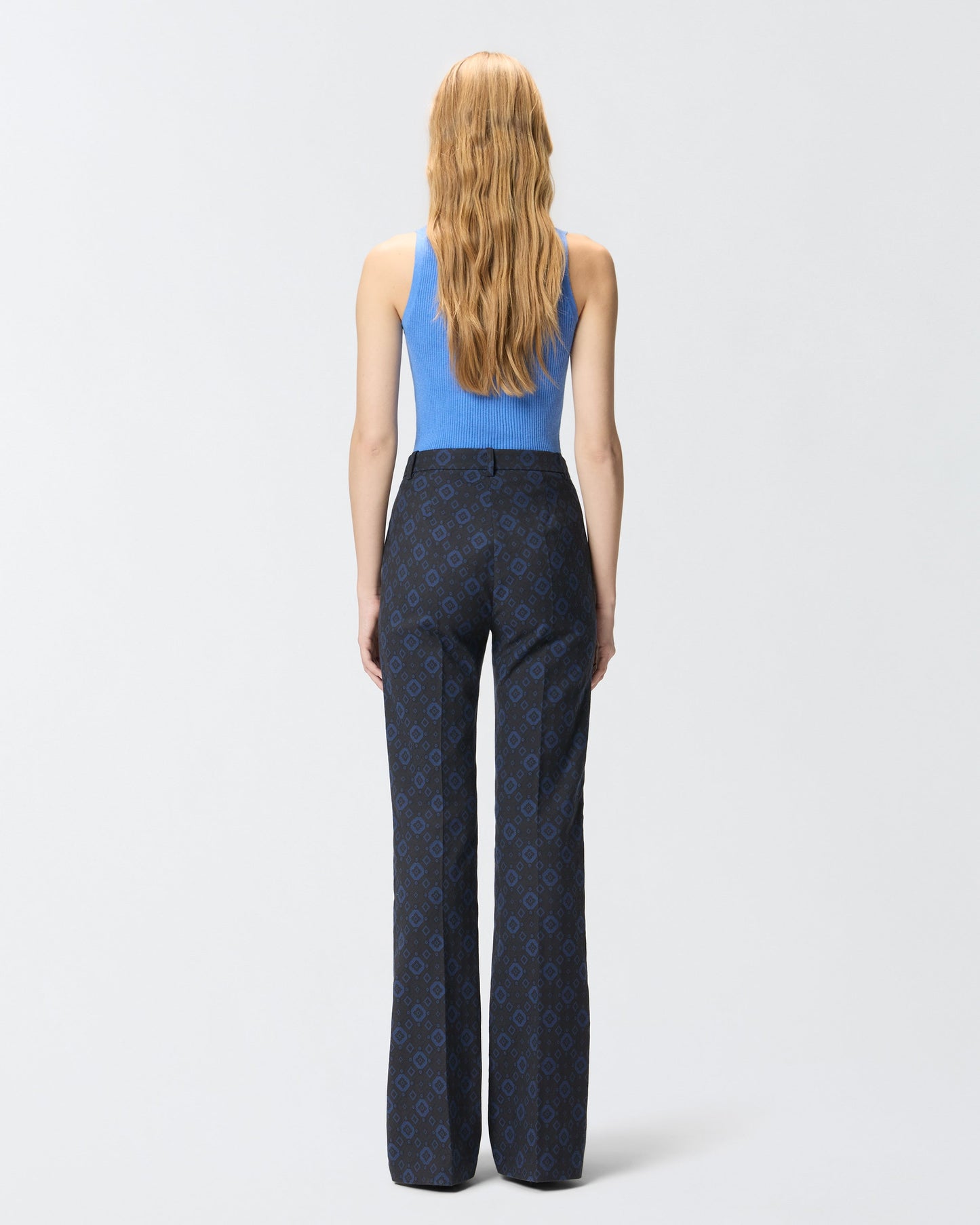 Trousers with a geometric and floral motif