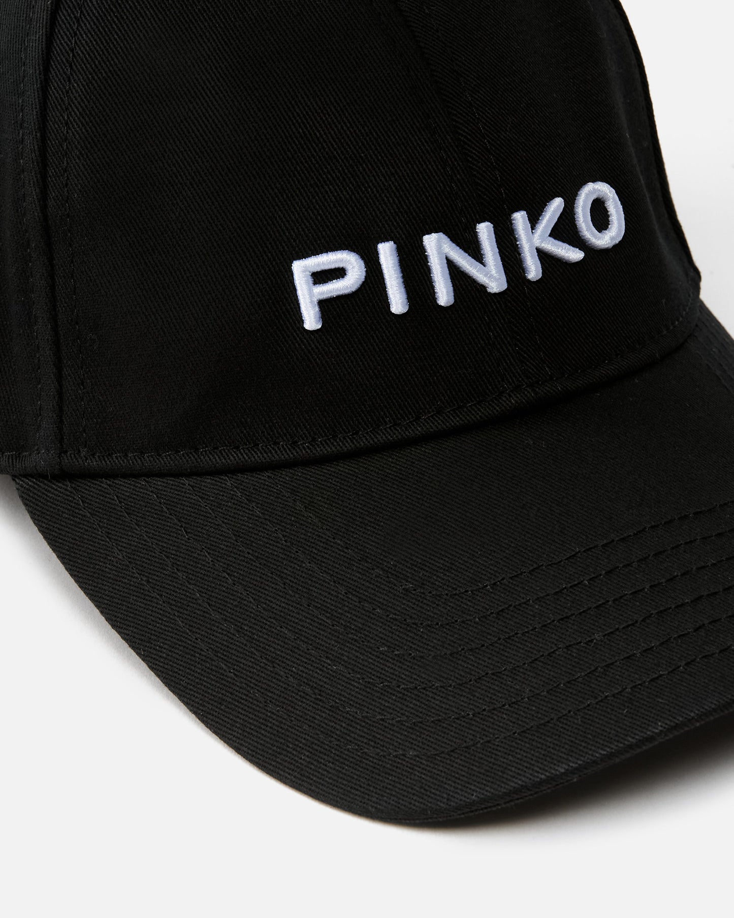 Cap with peak and embroidered logo