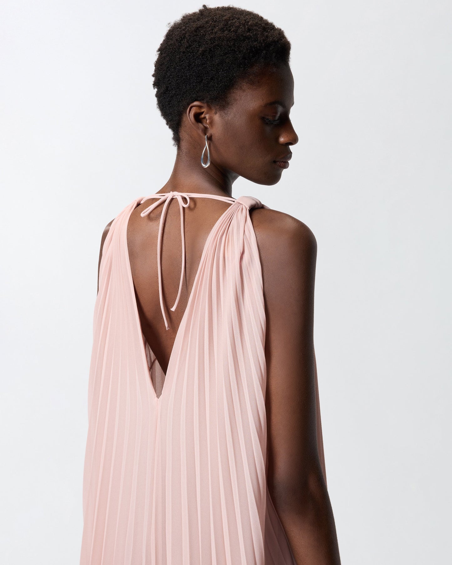 Long pleated dress with slit