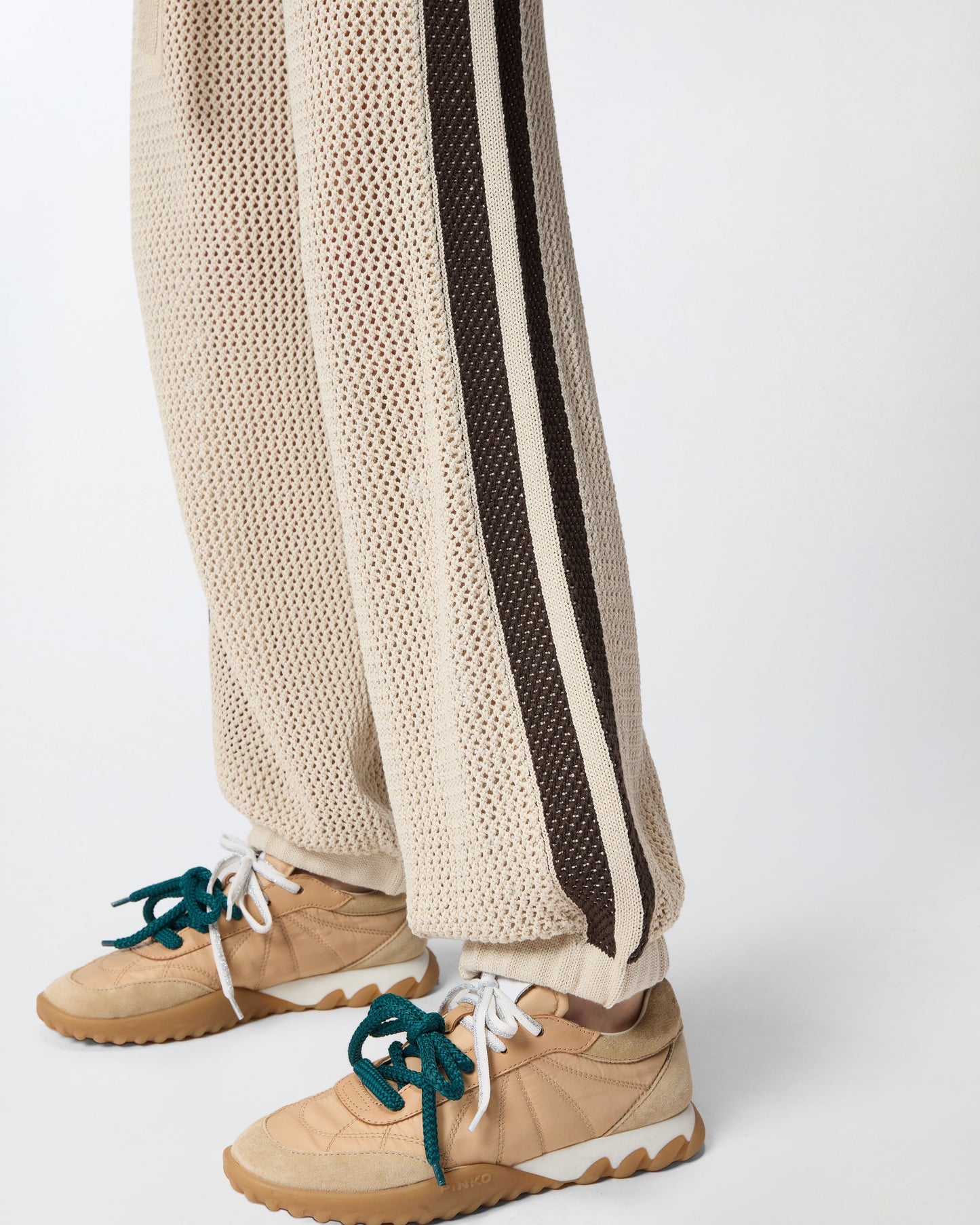 Openwork trousers with contrasting bands