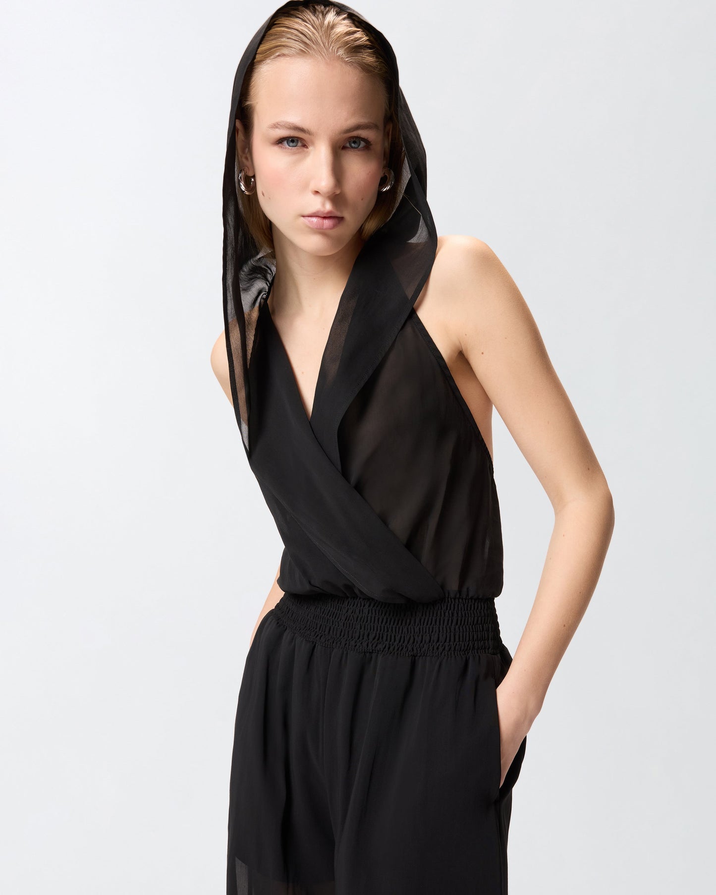 Long playsuit with hood and sheer details